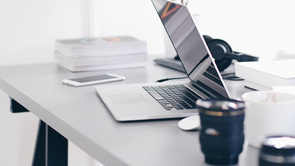 Business formation graphic with computer and camera